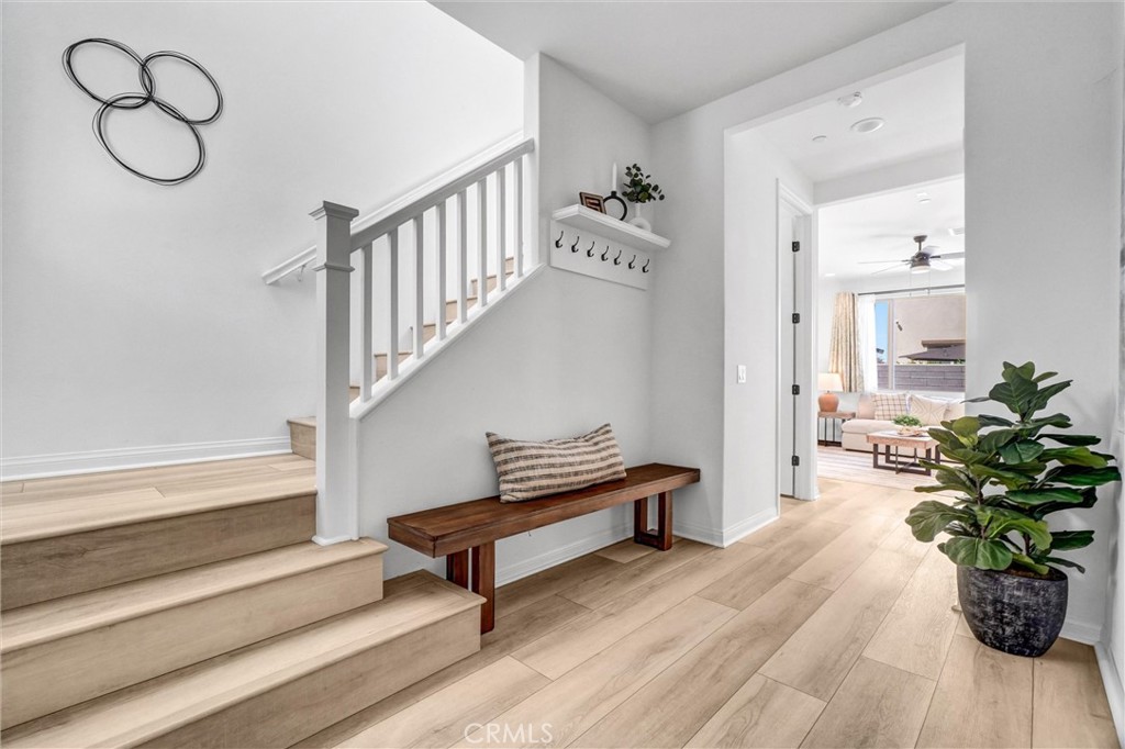 653 Longhorn Way Rancho Mission Viejo, CA 92694 - Photo 4 of 30 a view of entryway and hall with wooden floor