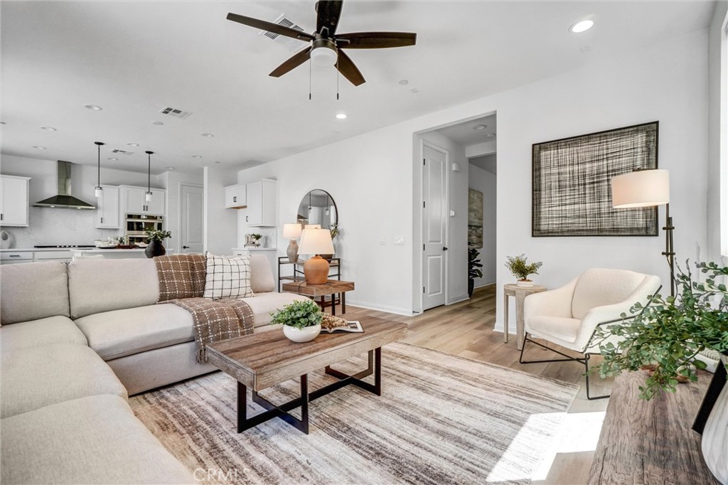 653 Longhorn Way Rancho Mission Viejo, CA 92694 - Photo 8 of 30 a living room with furniture and a potted plant