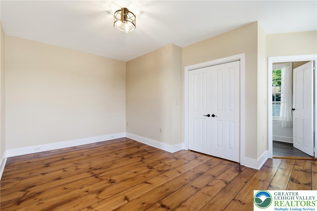 4682 Steuben Road Bethlehem, PA 18020 - Photo 32 of 79 Natural wood flooring complements this generously proportioned living space, ready for your personalized touch.