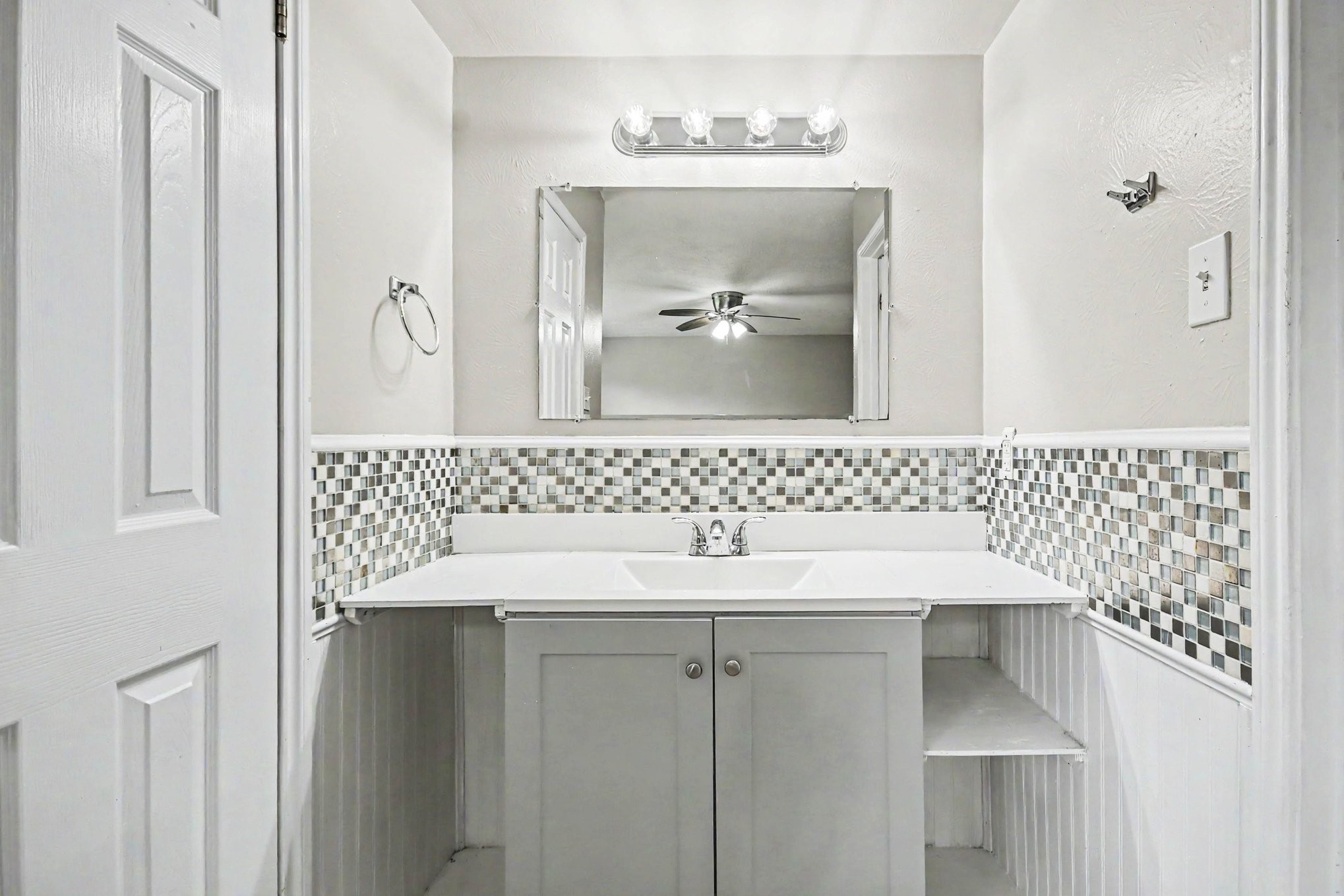 4306 Oneida Street Pasadena, TX 77504 - Photo 14 of 23 a bathroom with a sink and a mirror