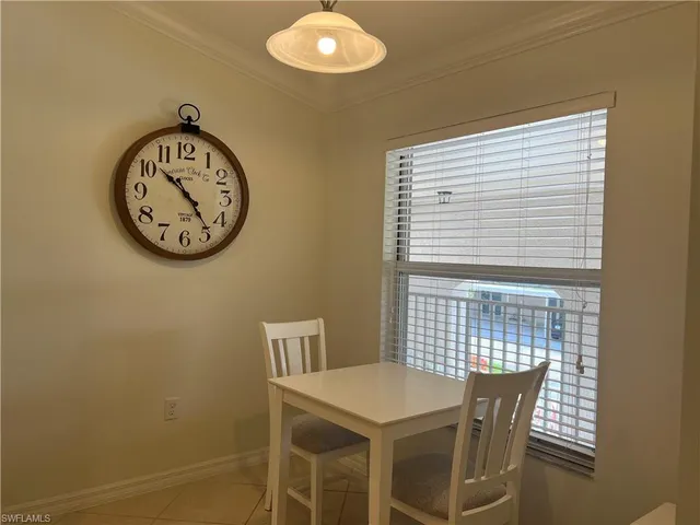 a view of a dining space with a table and chairs