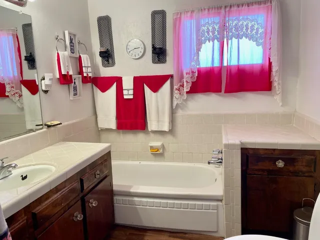a bathroom with a sink vanity and mirror
