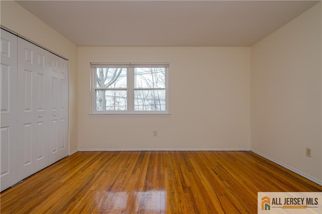 161 Evergreen Road, Unit 12B Edison, NJ 08837 - Photo 13 of 19 wooden floor in a room