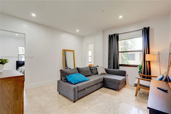 a living room with furniture and a window