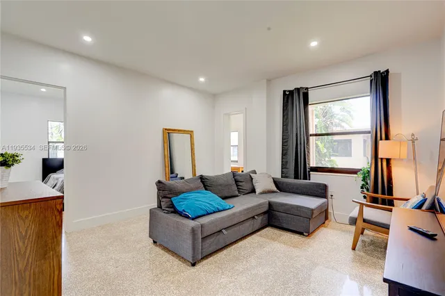 a living room with furniture and a window