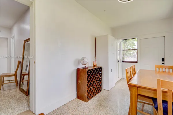a living room with furniture a table and a window