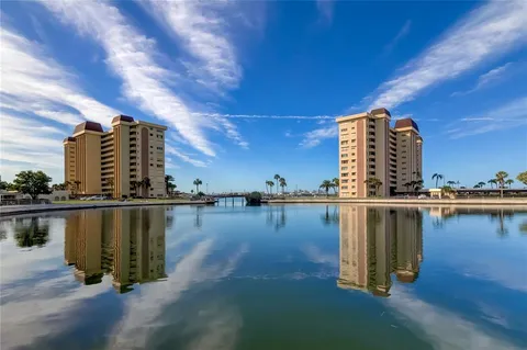 a view of a lake with a large building