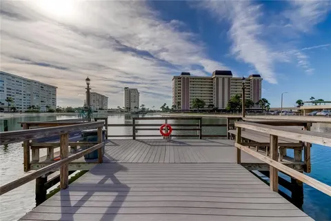 a view of outdoor space with wooden floor and city view