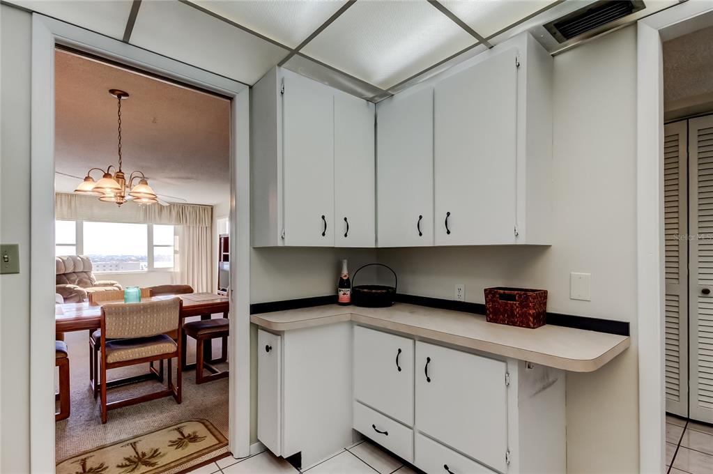 4775 Cove Circle, Unit 1008 St. Petersburg, FL 33708 - Photo 10 of 45 a kitchen with a sink and cabinets