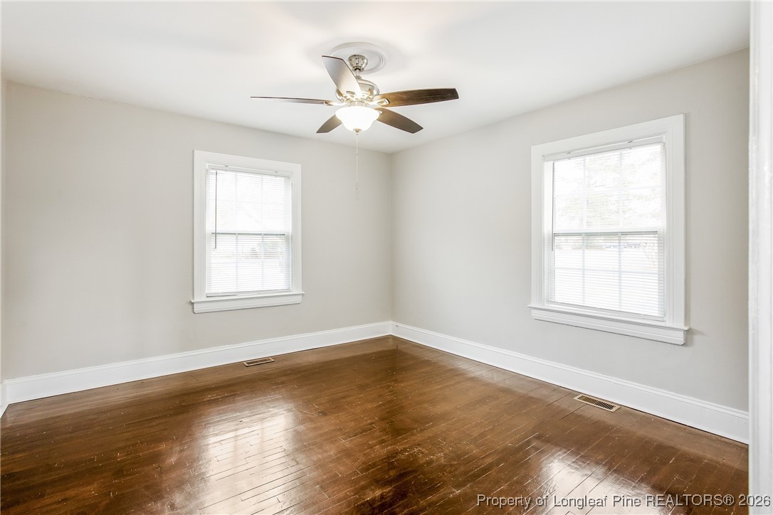 414 Mc Pherson Road Fayetteville, NC 28303 - Photo 13 of 16 a view of an empty room with wooden floor and a window