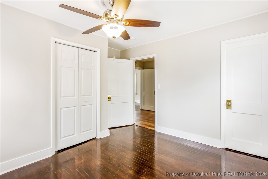 414 Mc Pherson Road Fayetteville, NC 28303 - Photo 14 of 16 an empty room with wooden floor closet and windows