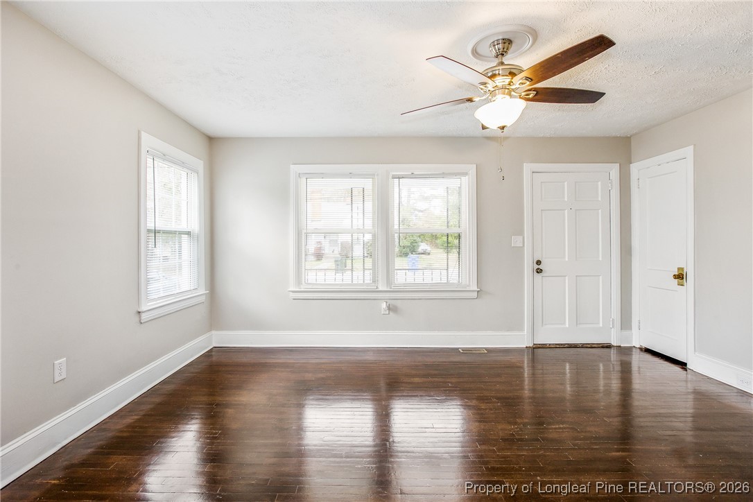 414 Mc Pherson Road Fayetteville, NC 28303 - Photo 6 of 16 a view of empty room with wooden floor and fan
