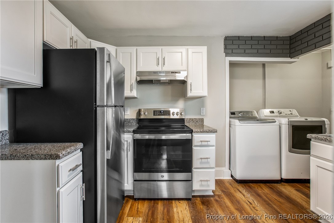 414 Mc Pherson Road Fayetteville, NC 28303 - Photo 7 of 16 a kitchen with a stove and a refrigerator