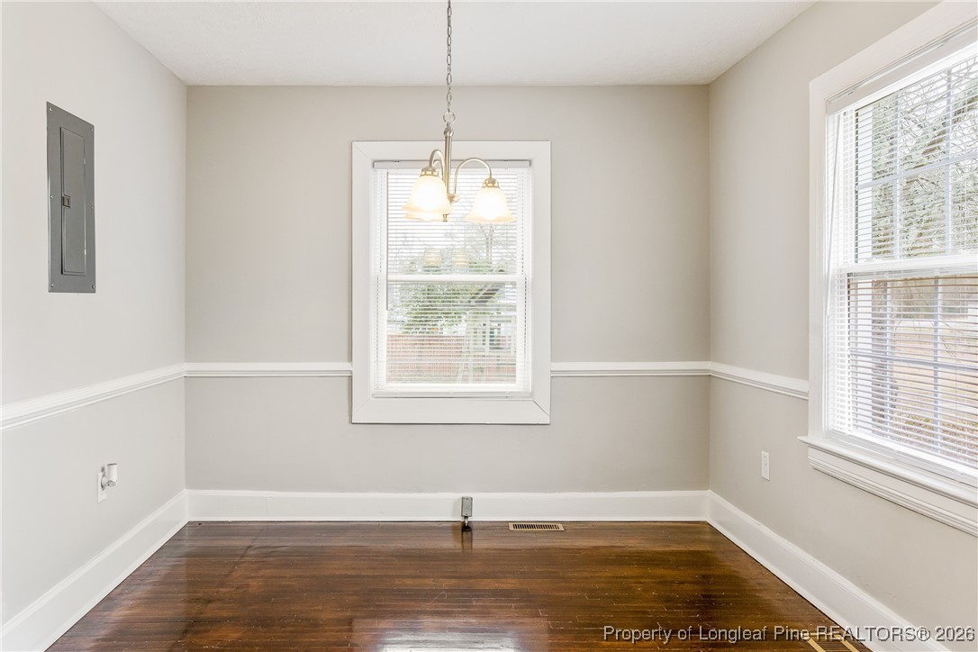 414 Mc Pherson Road Fayetteville, NC 28303 - Photo 10 of 16 a view of an empty room with wooden floor and a window