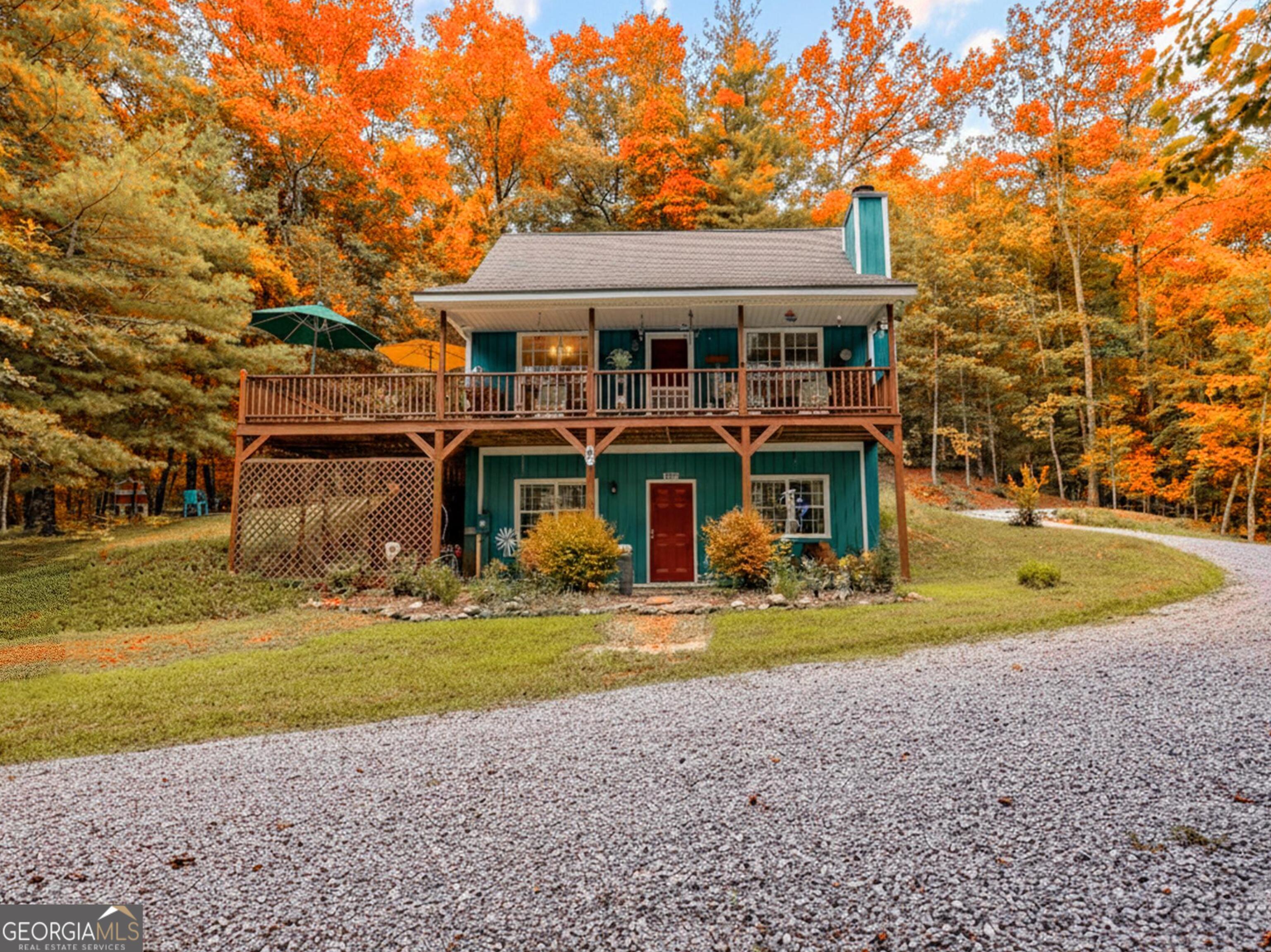 249 Spruce Creek Road Lakemont, GA 30552 - Photo 1 of 55 a view of a house with swimming pool and sitting area