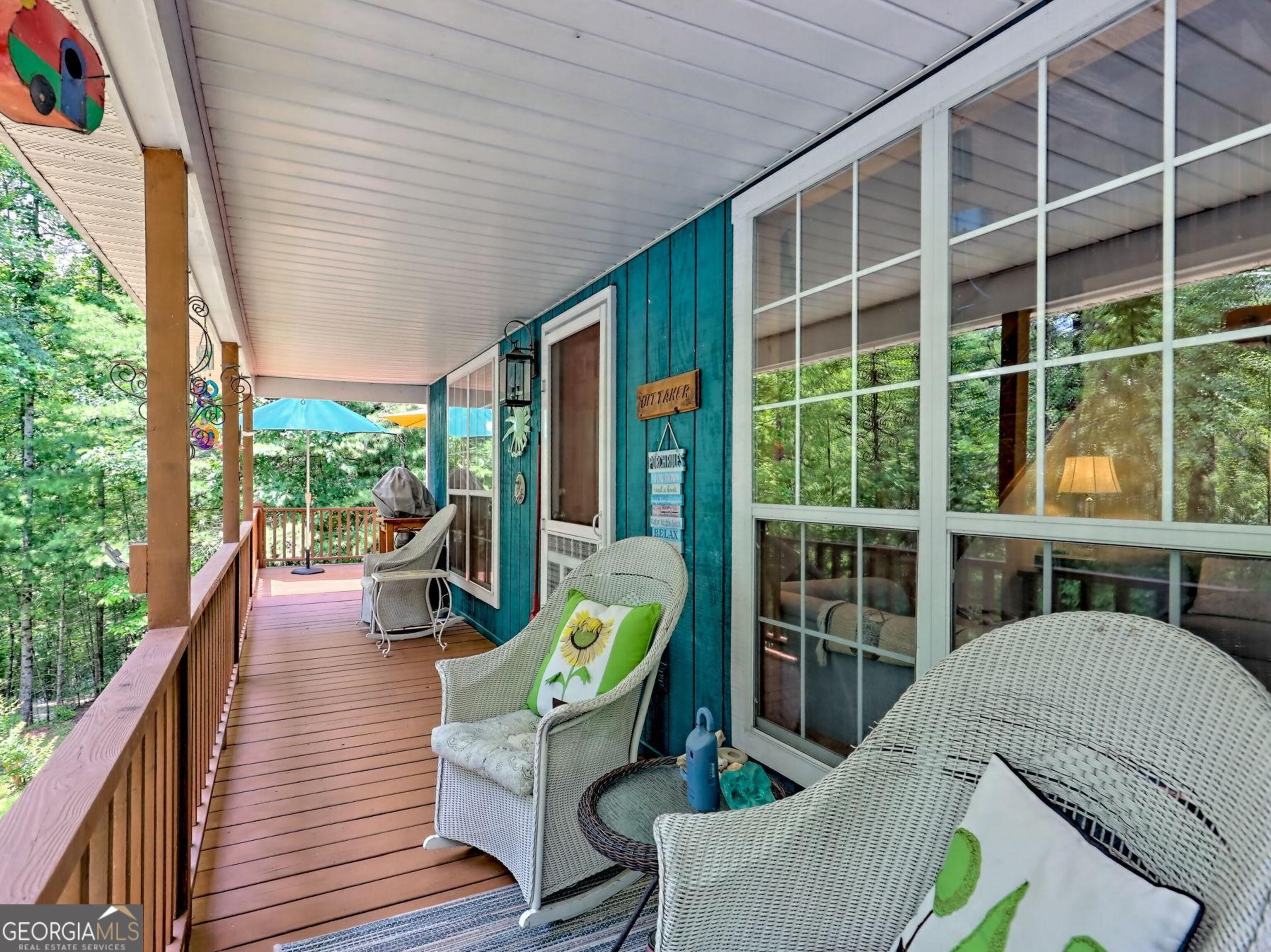 249 Spruce Creek Road Lakemont, GA 30552 - Photo 14 of 55 a balcony with furniture and a potted plant