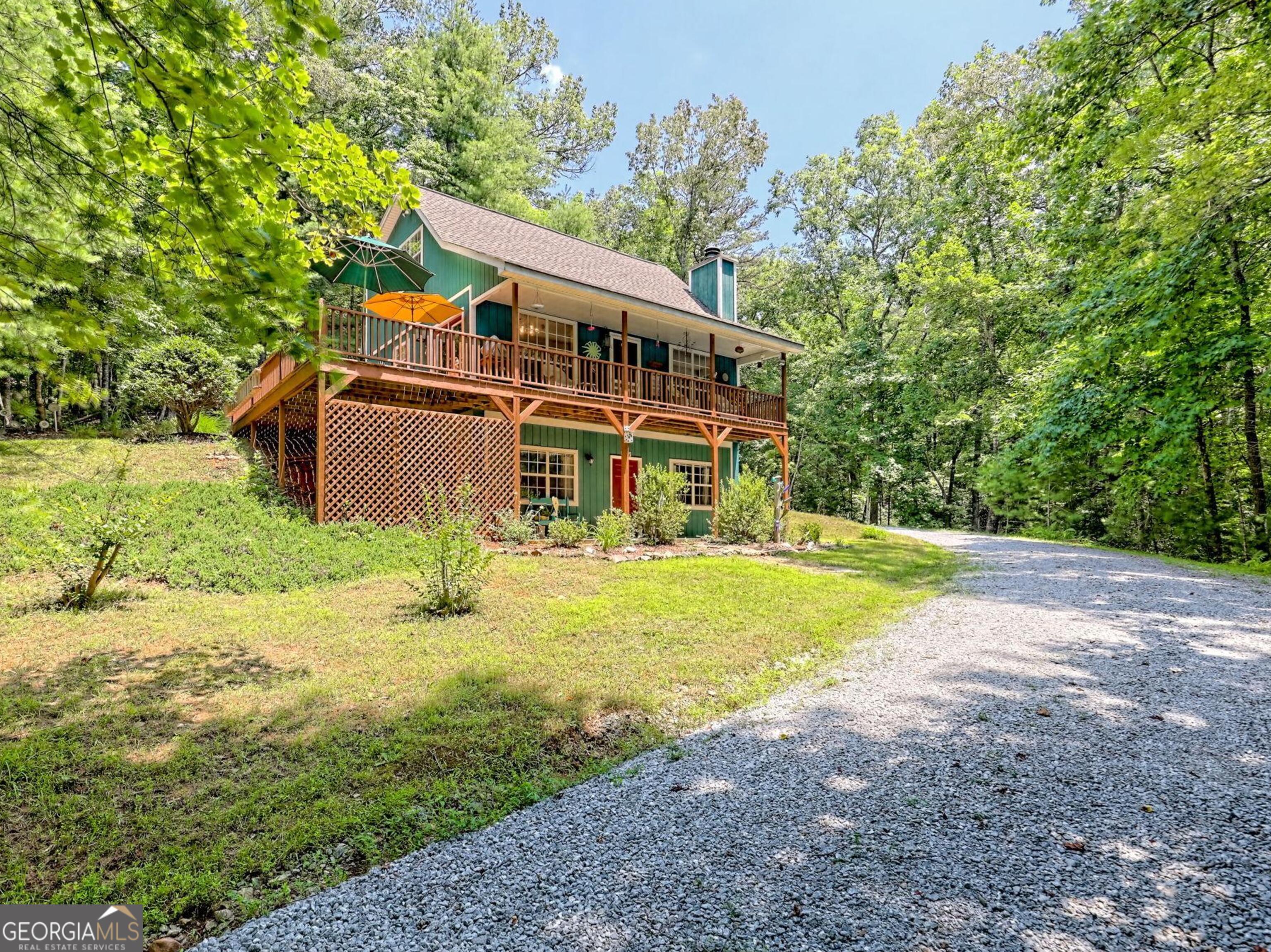 249 Spruce Creek Road Lakemont, GA 30552 - Photo 2 of 55 a view of an house with backyard space and balcony