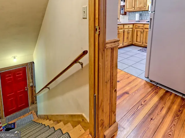 a living room with furniture and stairs