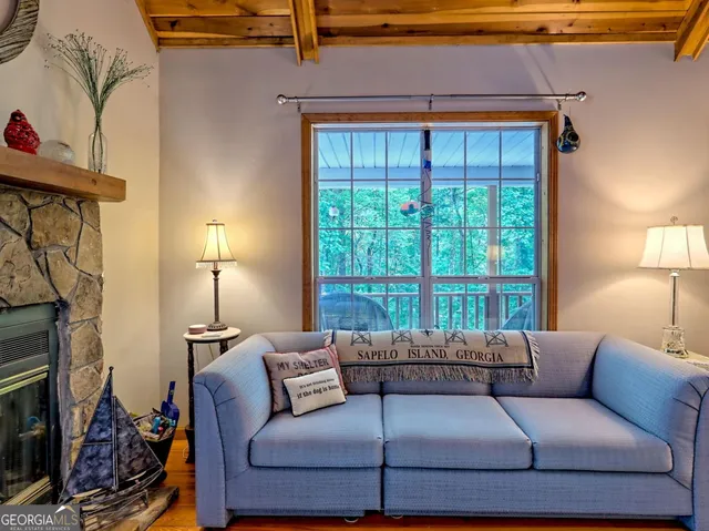 a room with furniture and a flat screen tv