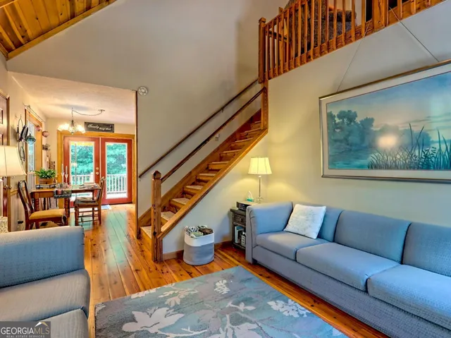 a bedroom with furniture and a rug