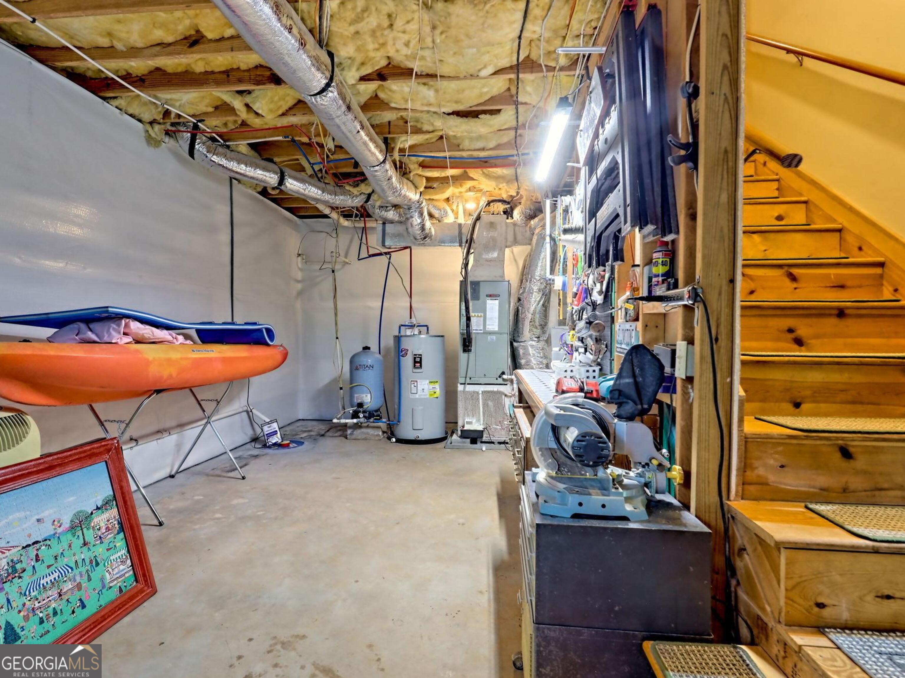 249 Spruce Creek Road Lakemont, GA 30552 - Photo 45 of 55 a view of walk in closet with clothes and shoes