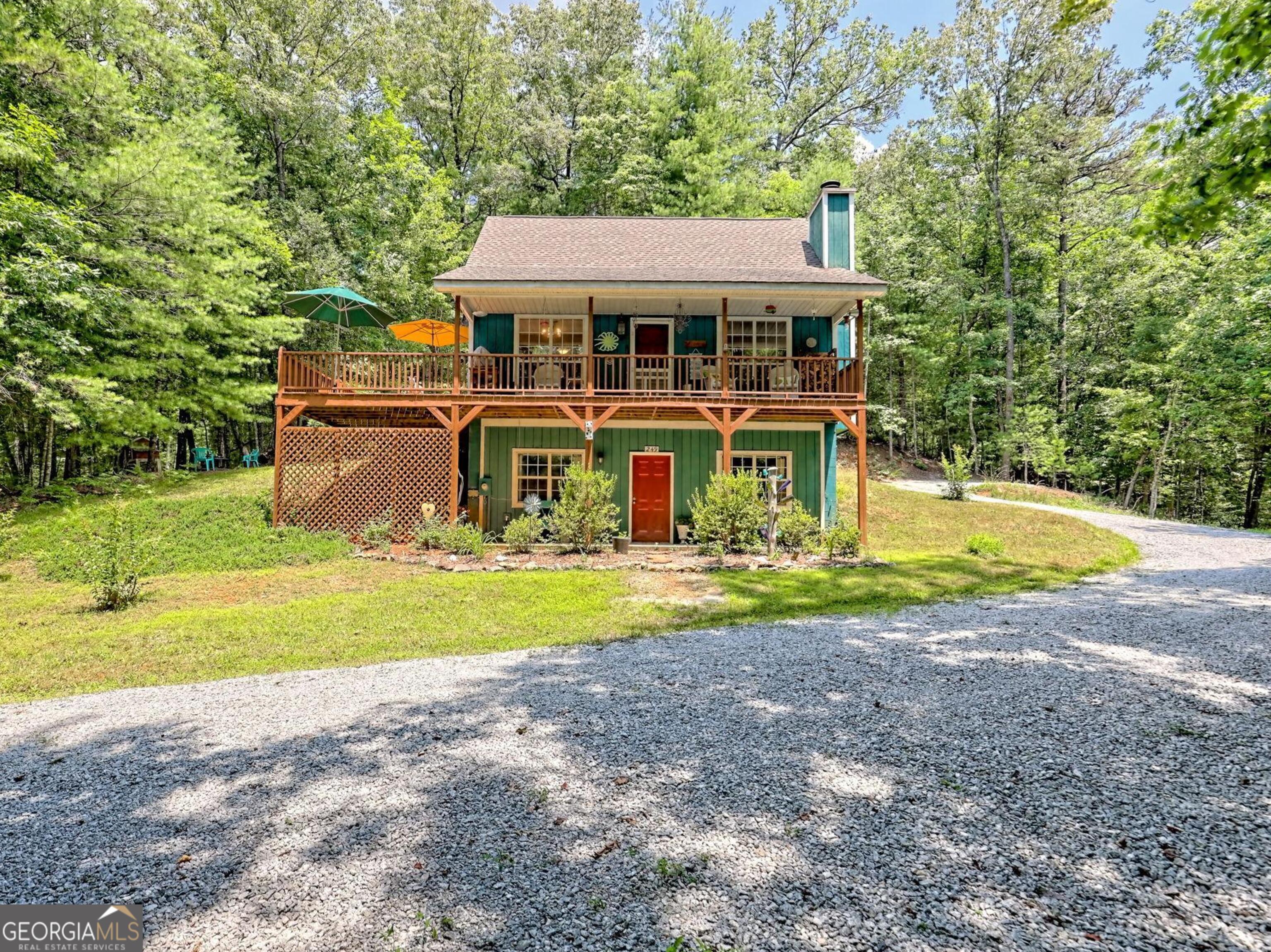 249 Spruce Creek Road Lakemont, GA 30552 - Photo 7 of 55 a view of a house with pool and a yard