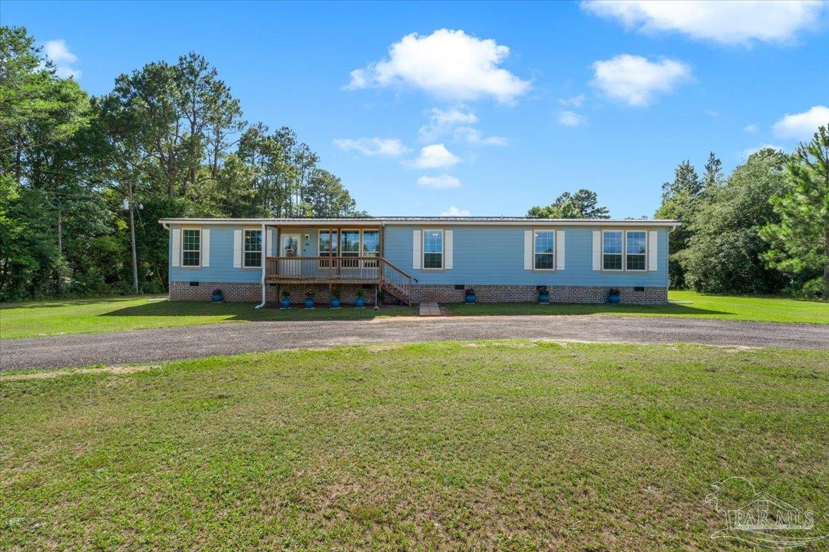 4955 Blue Ribbon Drive Milton, FL 32583 - Photo 32 of 32 a view of a house with a swimming pool