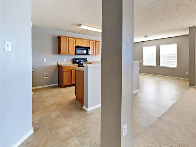 a view of a kitchen with a sink and dishwasher kitchen view