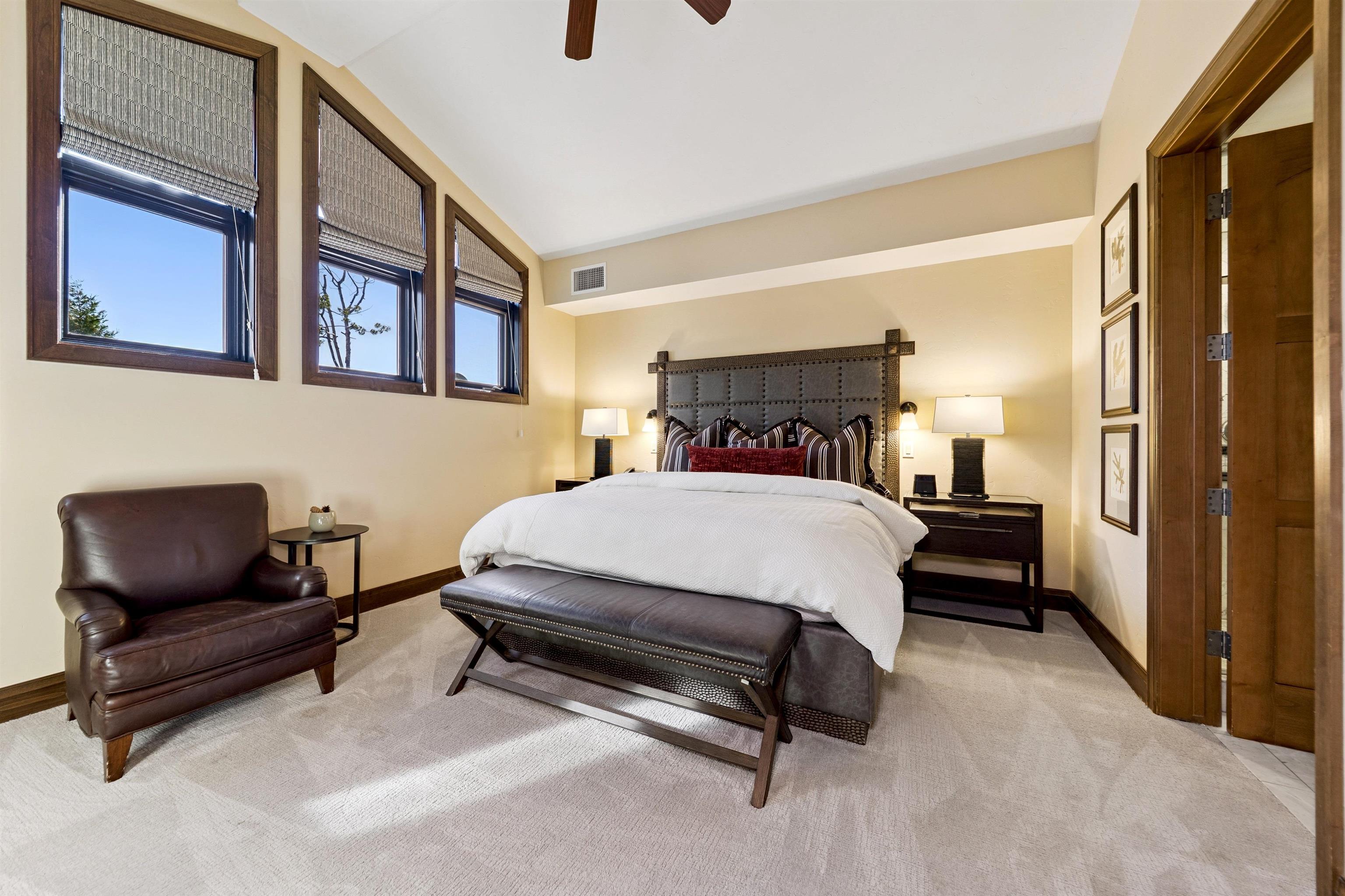 6750 North Lake Boulevard, Unit 10B Tahoe Vista, CA 96148 - Photo 13 of 23 a bed room with a bed and a chair