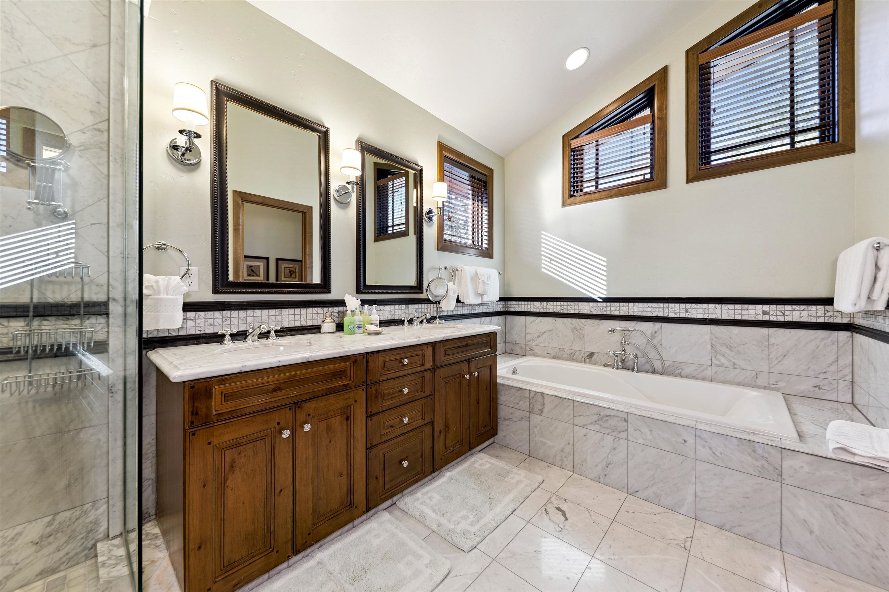 6750 North Lake Boulevard, Unit 10B Tahoe Vista, CA 96148 - Photo 17 of 23 a spacious bathroom with a tub sink and mirror