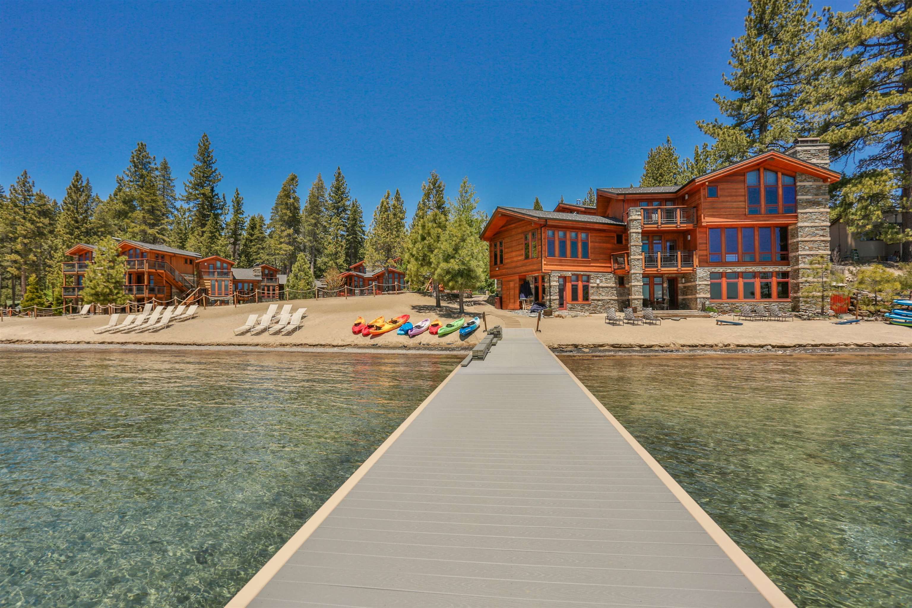 6750 North Lake Boulevard, Unit 10B Tahoe Vista, CA 96148 - Photo 2 of 23 a view of a lake with building and trees around