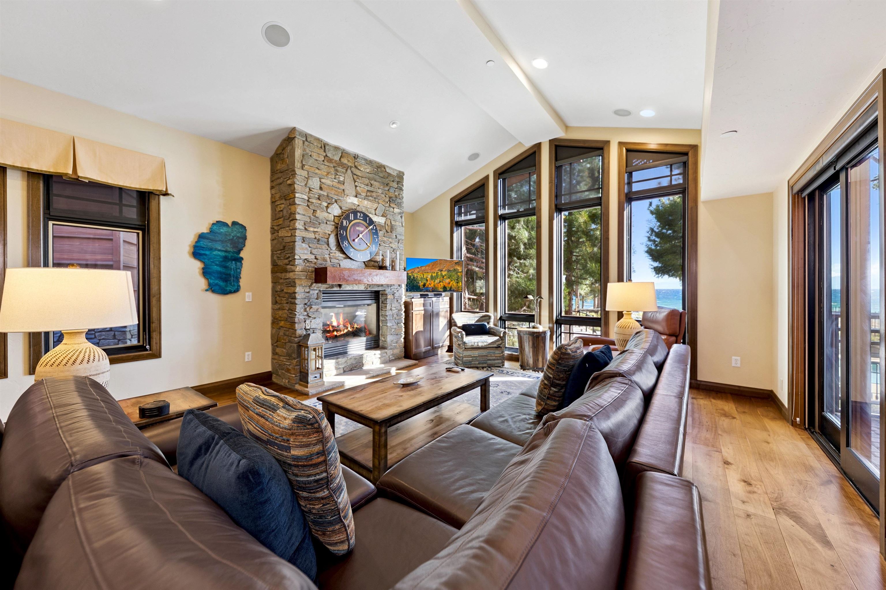 6750 North Lake Boulevard, Unit 10B Tahoe Vista, CA 96148 - Photo 6 of 23 a living room with furniture fireplace and a large window
