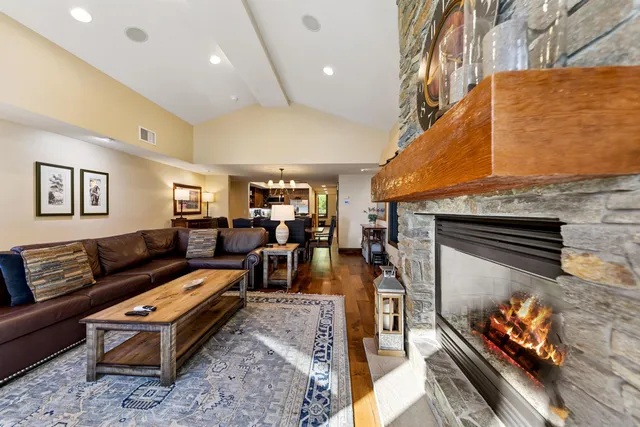 a living room with furniture flat screen tv and a fireplace