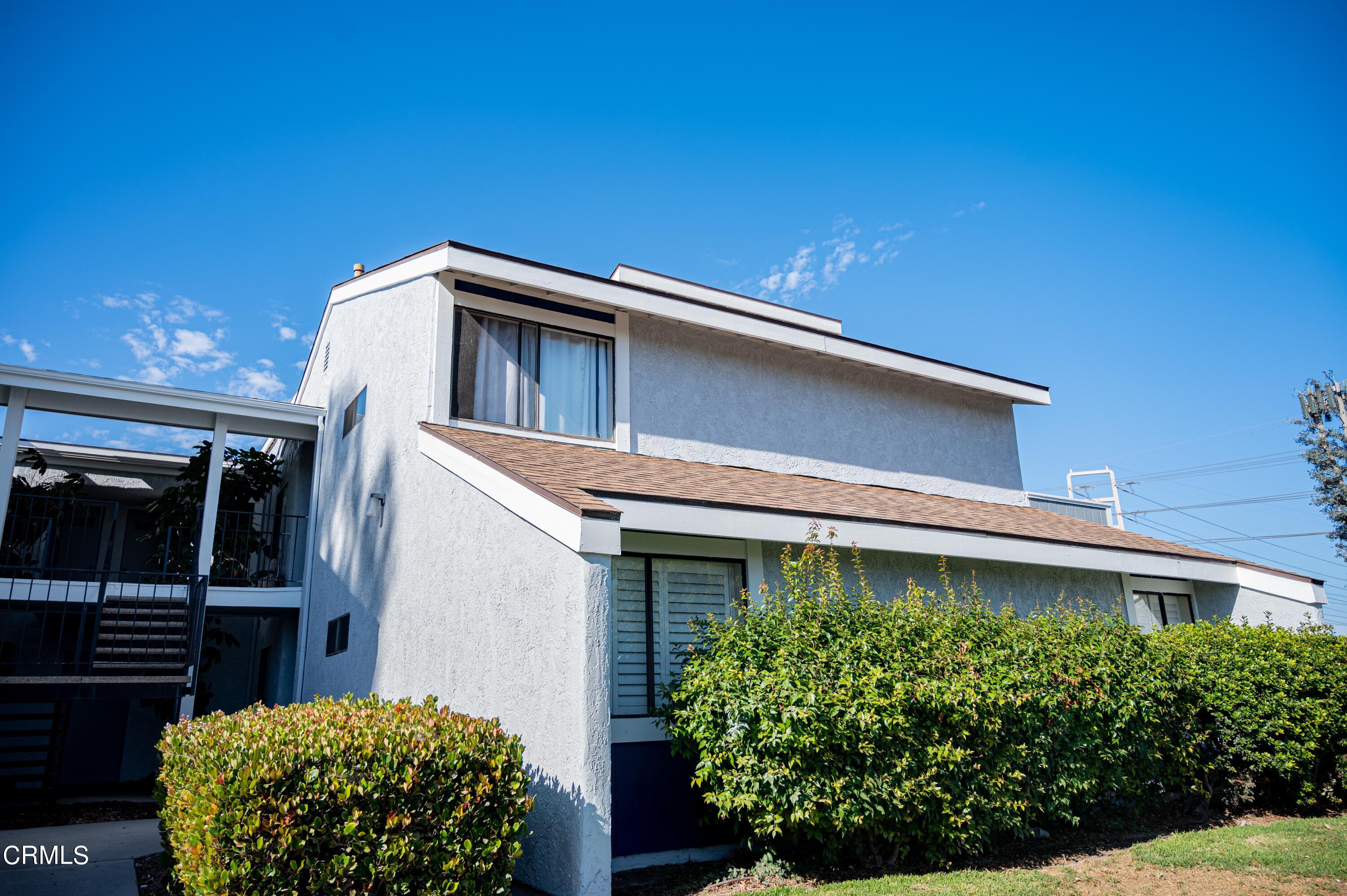 5170 Longfellow Way Oxnard, CA 93033 - Photo 2 of 12 a front view of a house with garden