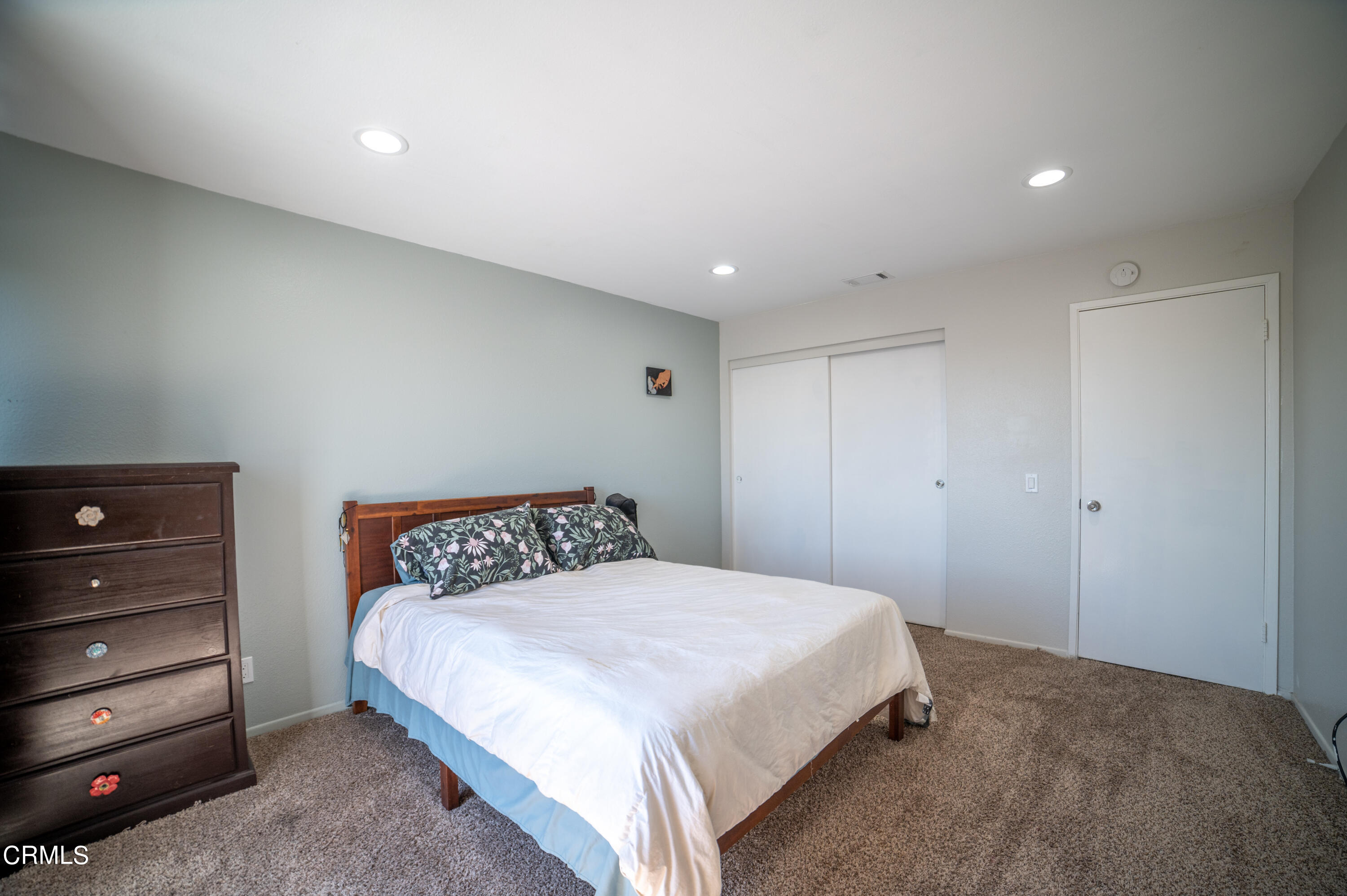 5170 Longfellow Way Oxnard, CA 93033 - Photo 11 of 12 a bedroom with a bed and a dresser