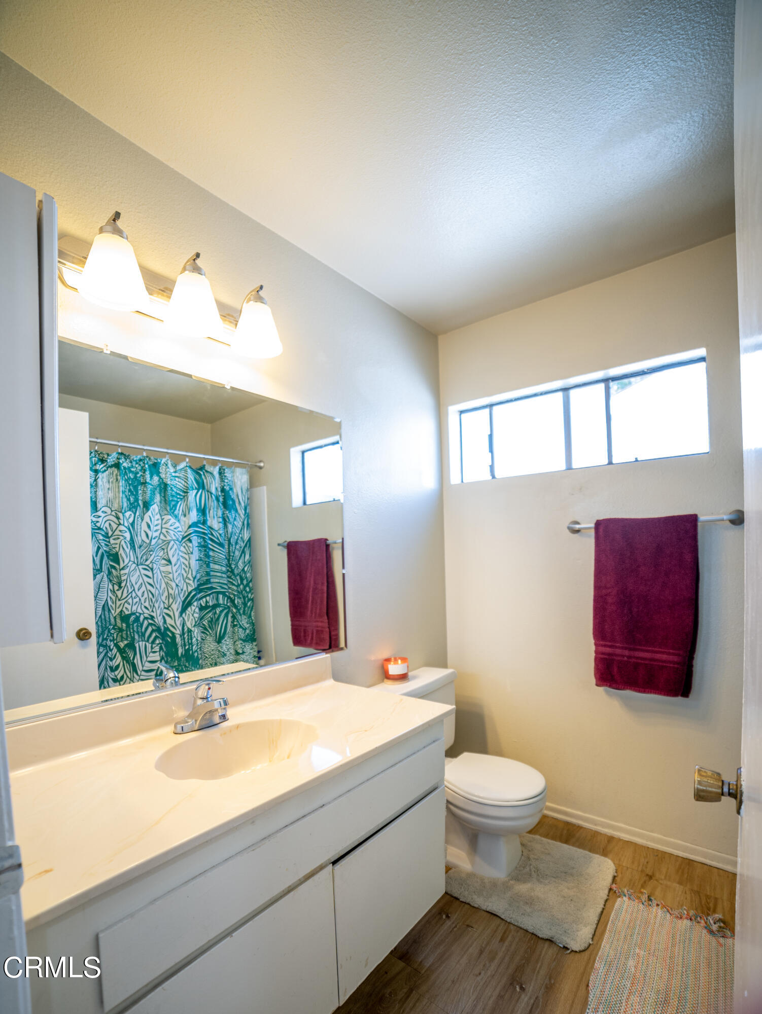 5170 Longfellow Way Oxnard, CA 93033 - Photo 10 of 12 a bathroom with a toilet sink and mirror