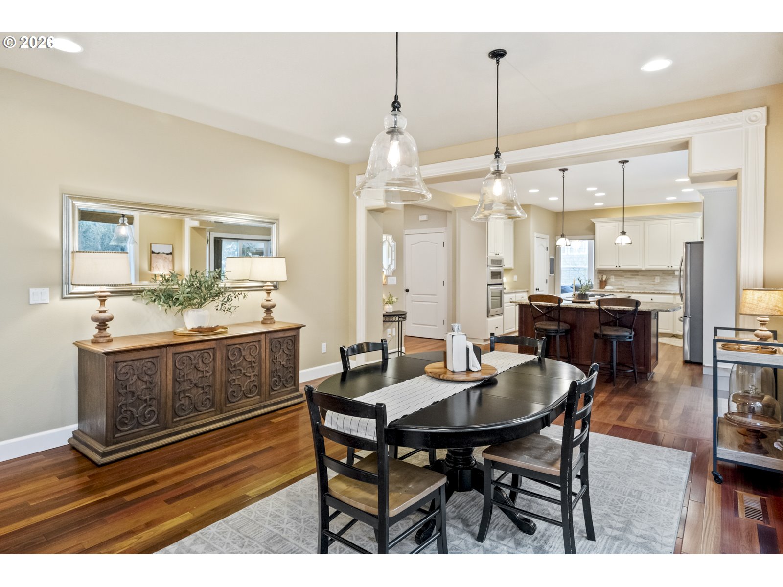 16520 Southwest Marcile Lane Beaverton, OR 97007 - Photo 11 of 45 a dining hall with stainless steel appliances kitchen island a table and chairs
