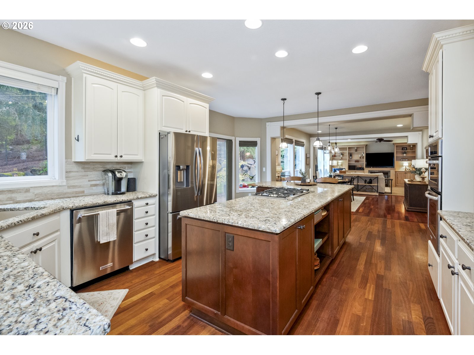16520 Southwest Marcile Lane Beaverton, OR 97007 - Photo 14 of 45 a kitchen with stainless steel appliances granite countertop a refrigerator a stove and a sink