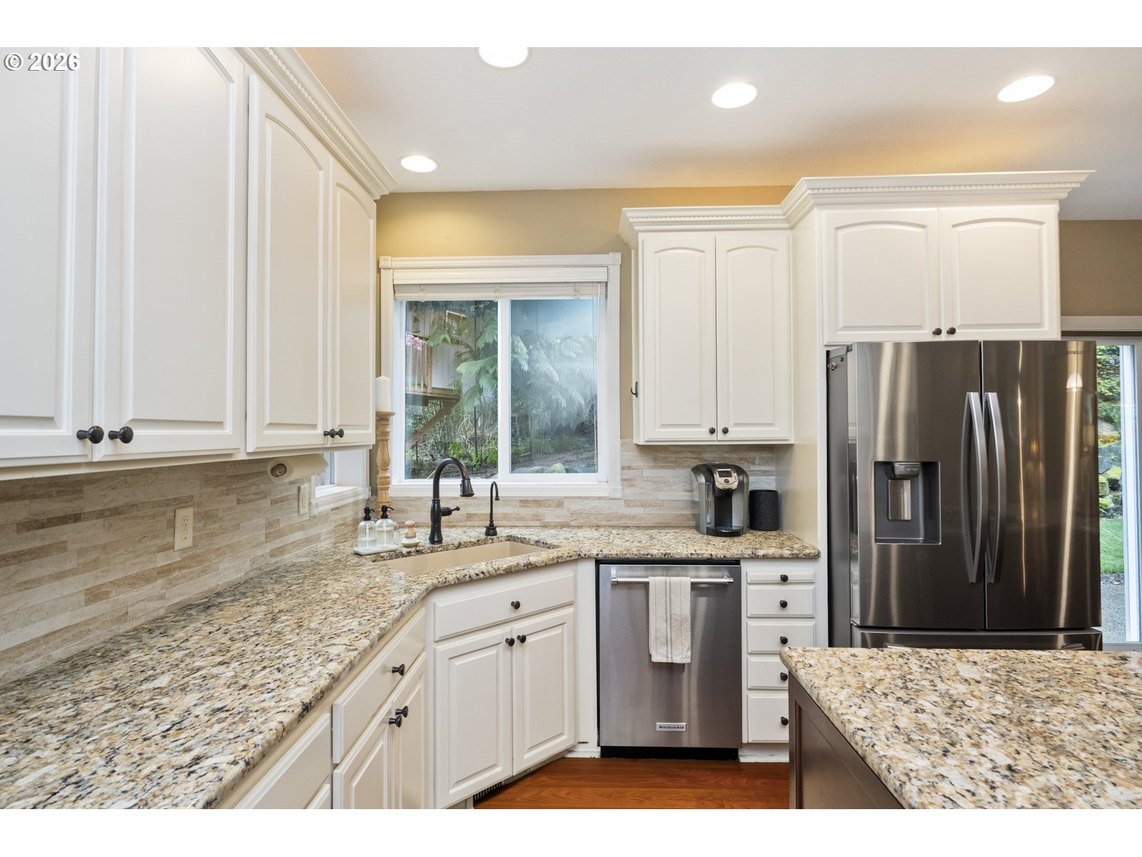 16520 Southwest Marcile Lane Beaverton, OR 97007 - Photo 15 of 45 a kitchen with granite countertop a sink stainless steel appliances and cabinets