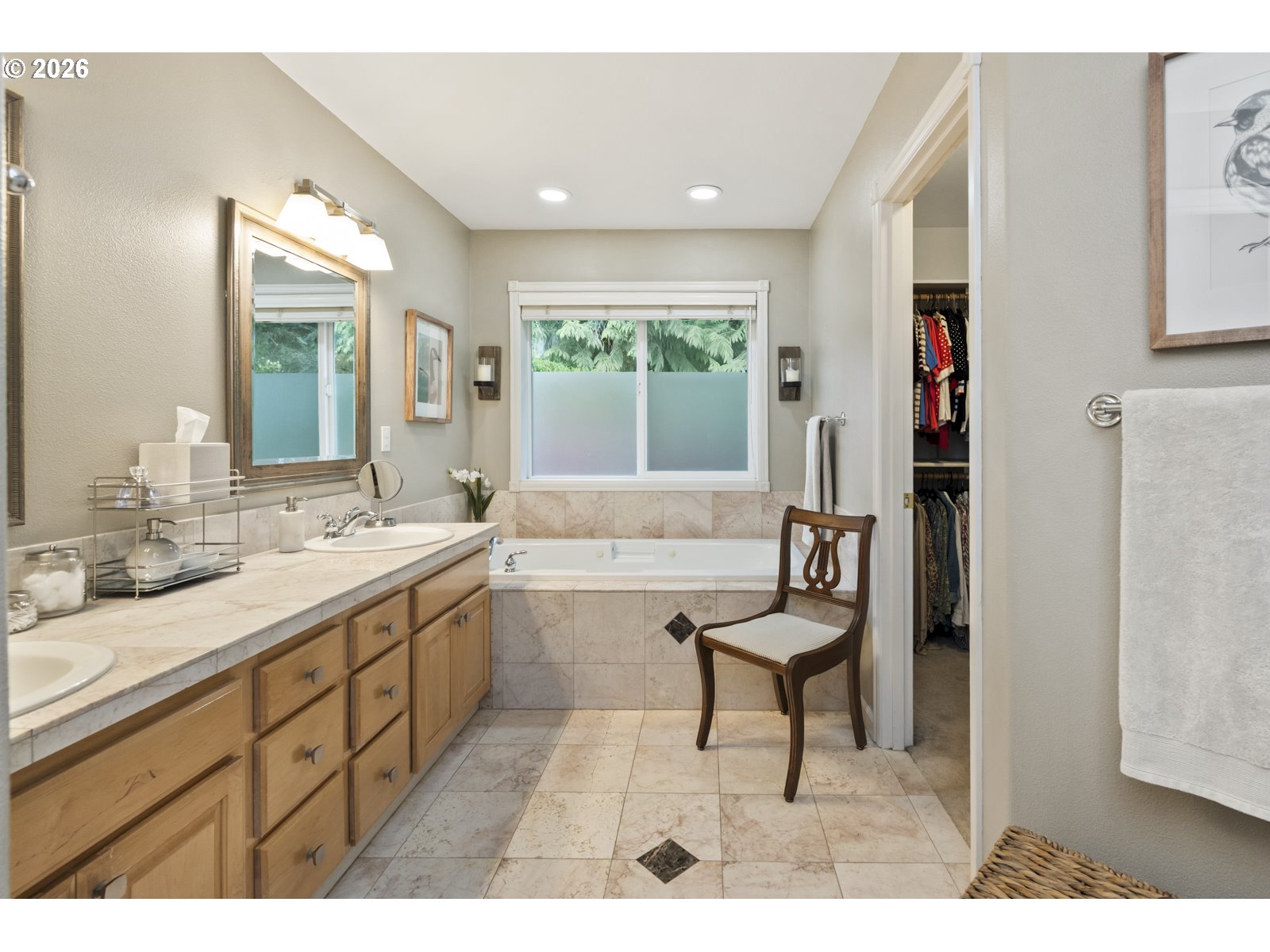 16520 Southwest Marcile Lane Beaverton, OR 97007 - Photo 27 of 45 a spacious bathroom with a vanity a sink and a mirror