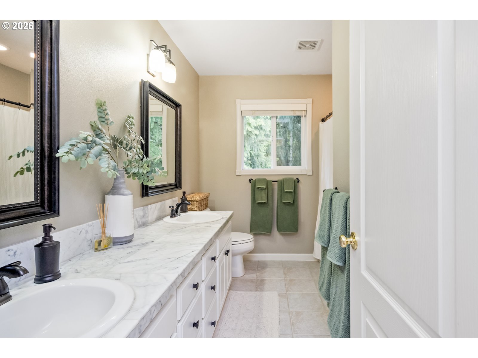 16520 Southwest Marcile Lane Beaverton, OR 97007 - Photo 33 of 45 a bathroom with a sink a mirror and a shower