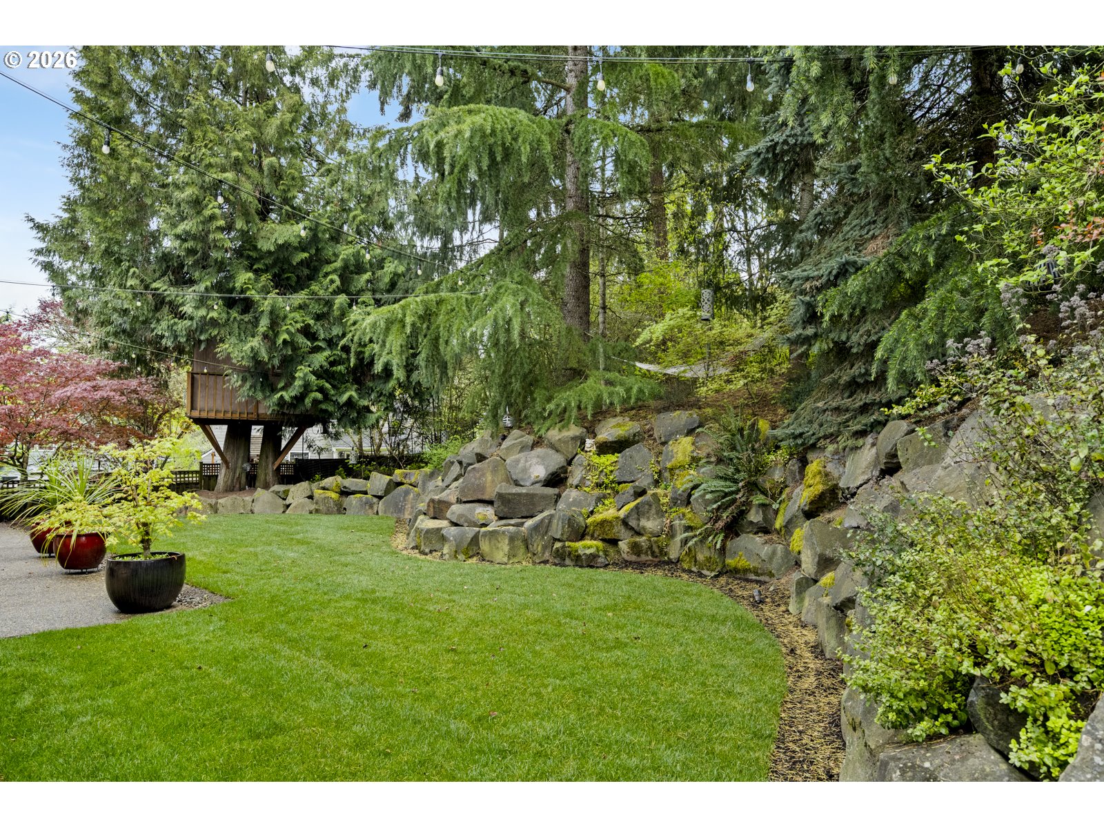 16520 Southwest Marcile Lane Beaverton, OR 97007 - Photo 43 of 45 a view of a garden with a bench