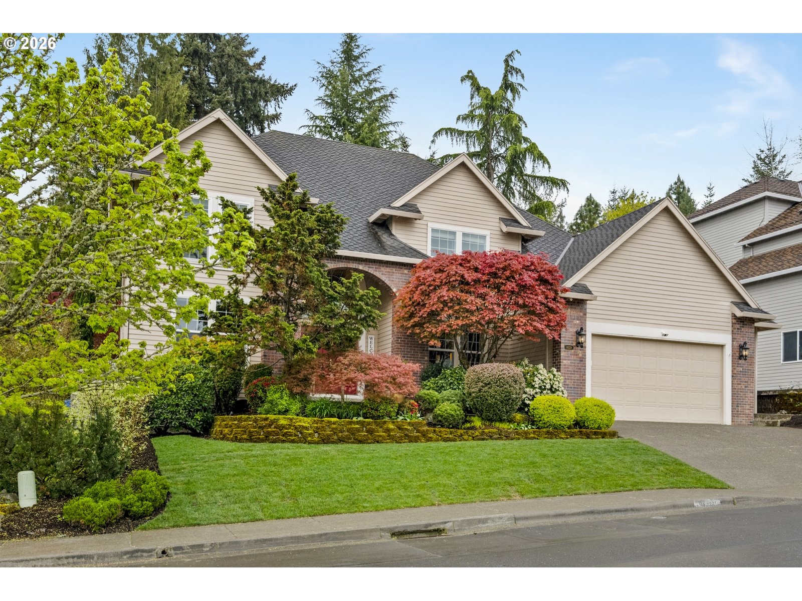 16520 Southwest Marcile Lane Beaverton, OR 97007 - Photo 44 of 45 a front view of a house with a yard