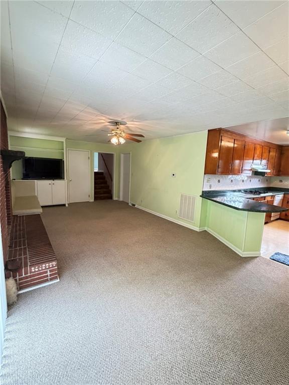 52 Lyons Drive Northwest Rome, GA 30165 - Photo 6 of 34 a view of a room with a gaming machine and wooden floor
