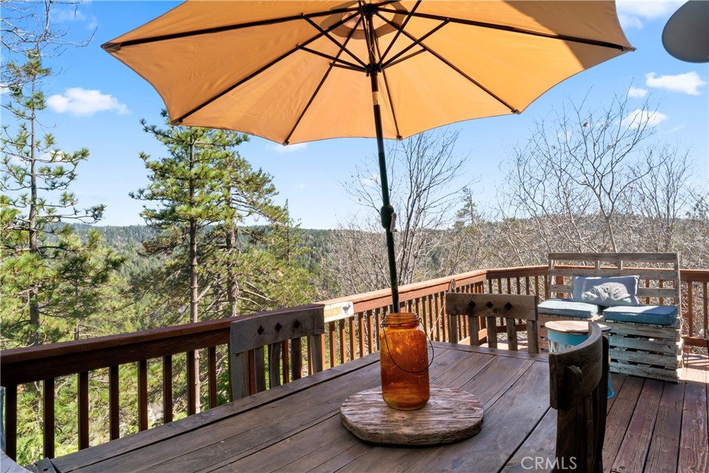 221 Grizzly Road Lake Arrowhead, CA 92352 - Photo 8 of 20 a view of balcony with furniture and wooden fence