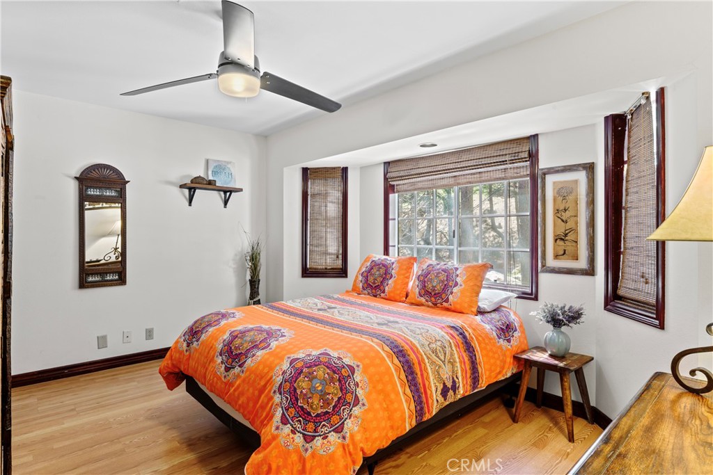 221 Grizzly Road Lake Arrowhead, CA 92352 - Photo 9 of 20 a bedroom with bed and glass door