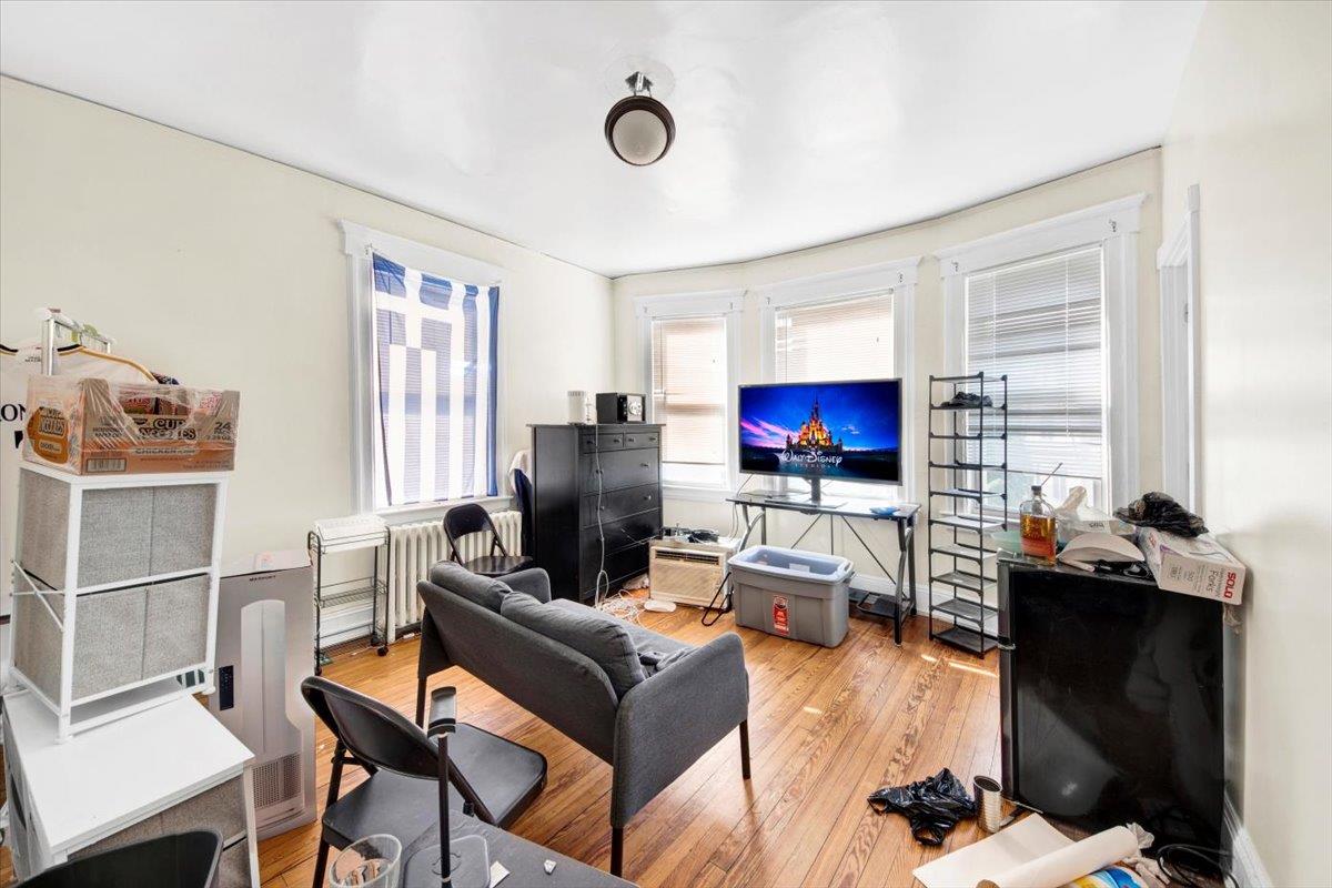 308 5th Avenue New Rochelle, NY 10801 - Photo 14 of 37 a living room with furniture kitchen view and a window