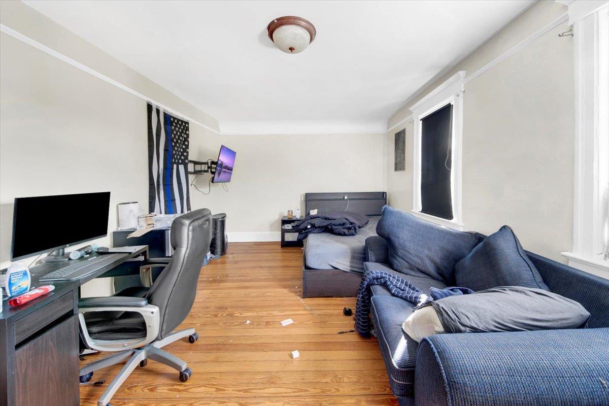 308 5th Avenue New Rochelle, NY 10801 - Photo 16 of 37 a living room with furniture a flat screen tv and a flat screen tv