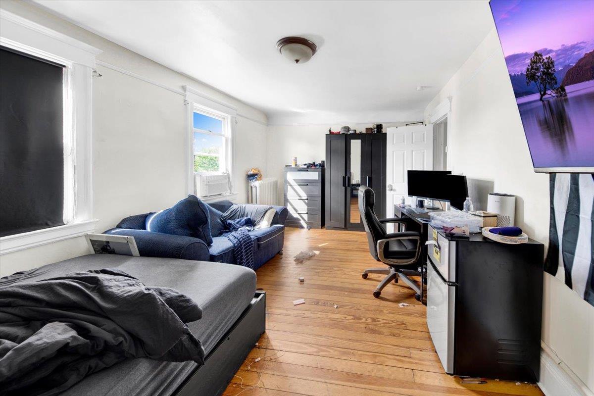 308 5th Avenue New Rochelle, NY 10801 - Photo 17 of 37 a living room with furniture and a flat screen tv