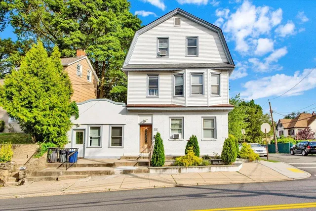 a front view of a house with a yard